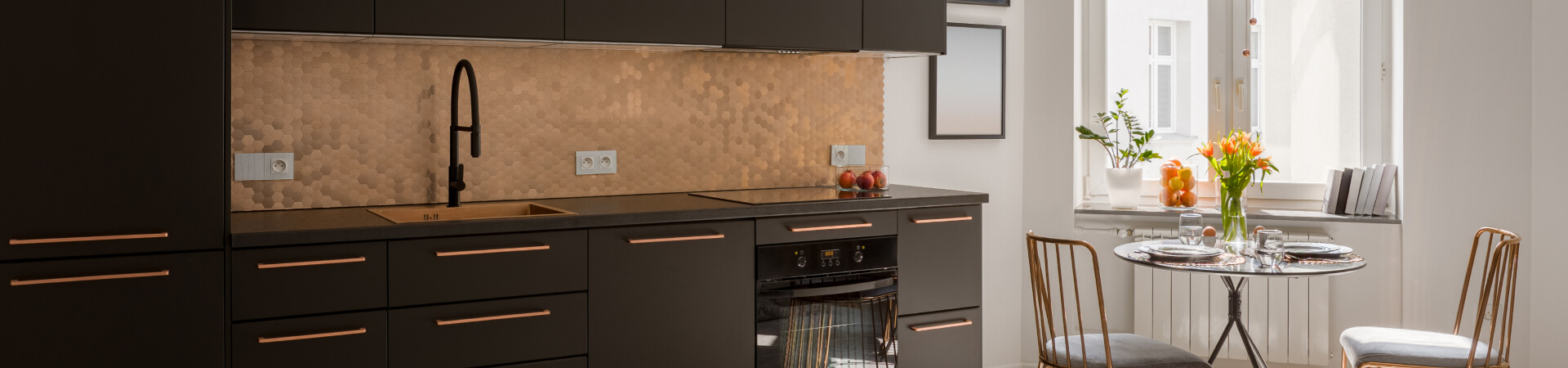 Kitchen with black and gold accents