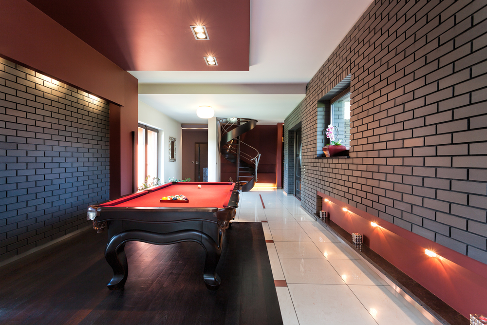 Basement renovation with red pool table