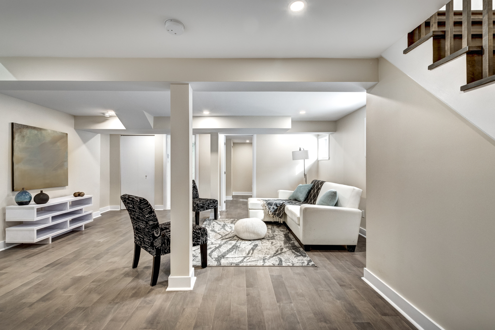 newly renovated basement with wood flooring