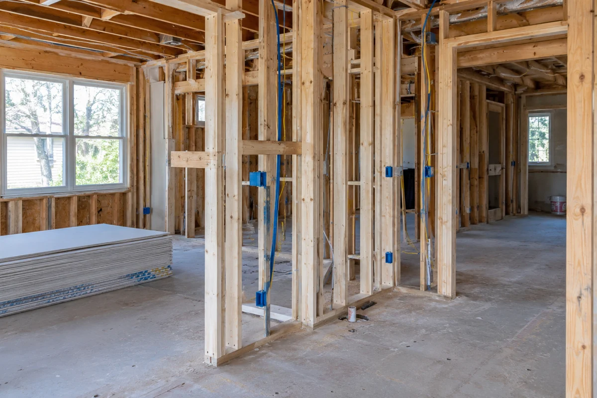 Open timber framing and electrical routing during a home renovation
